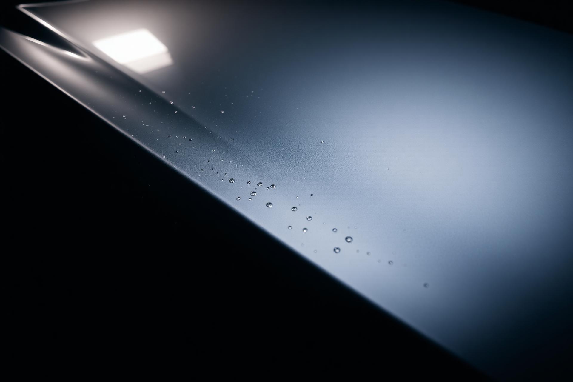 Ceramic-coated sports car hood with water beads